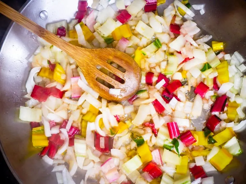 Sautéing diced onion and chard stems