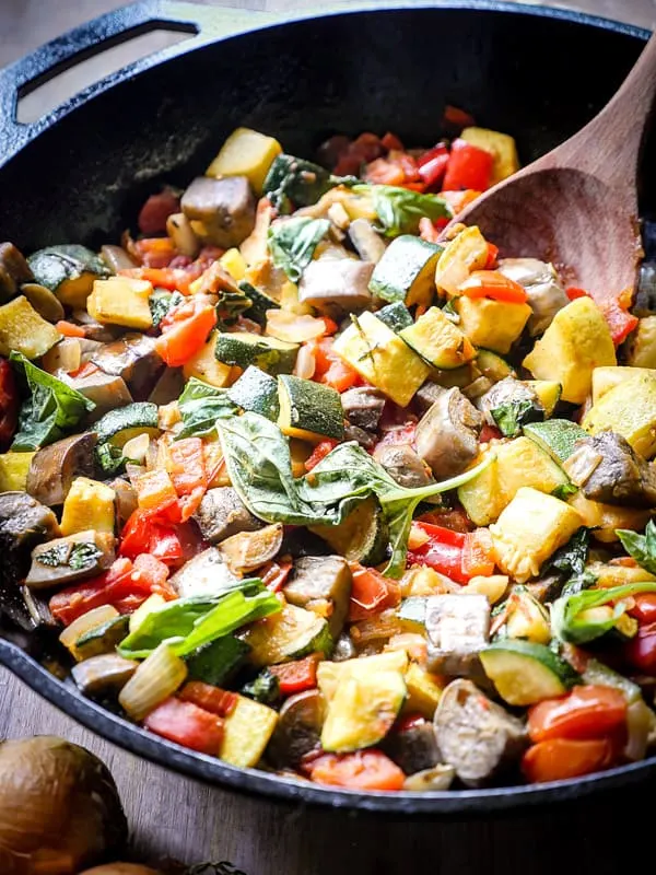 Easy Skillet Ratatouille with fresh basil leaves.