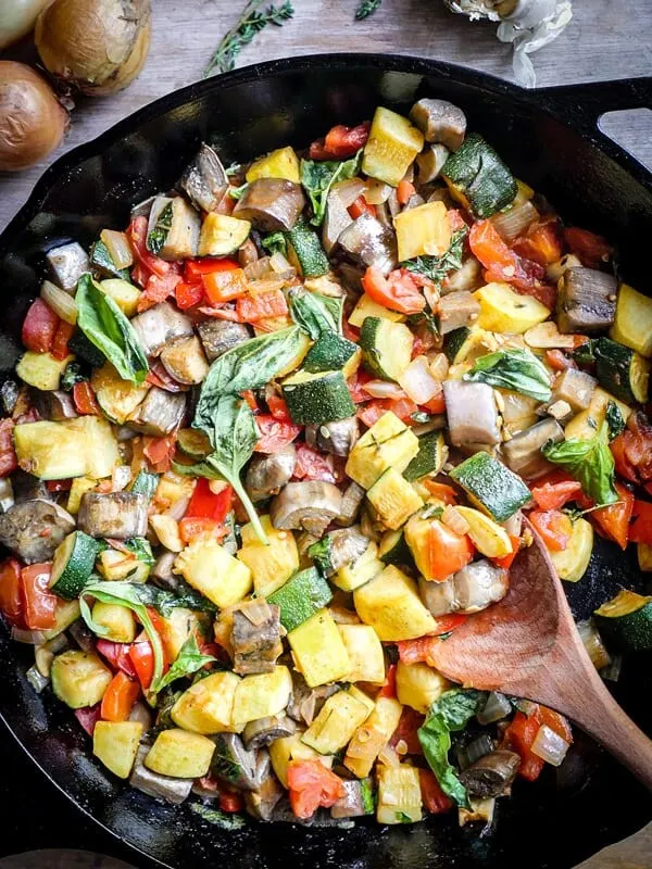 Easy Skillet Ratatouille in a cast iron skillet on a wooden tables