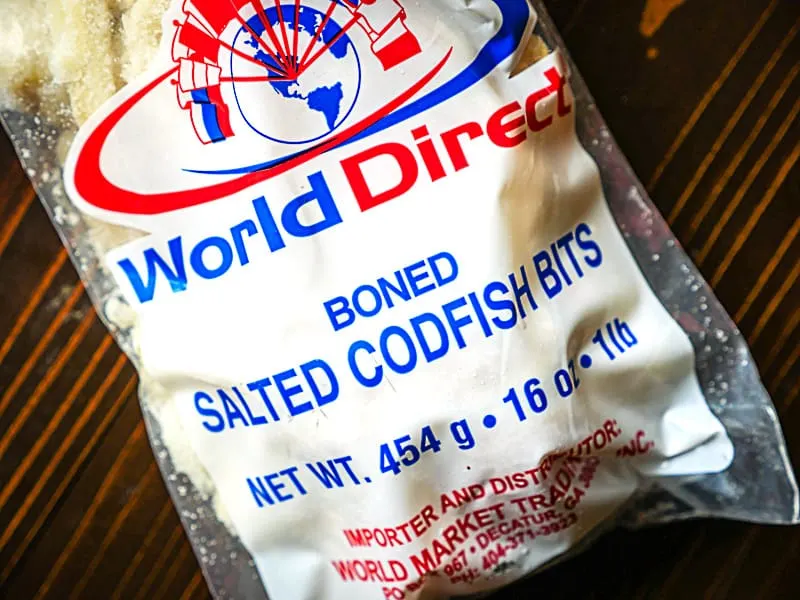 close up of a bag of salted codfish on a wooden background.